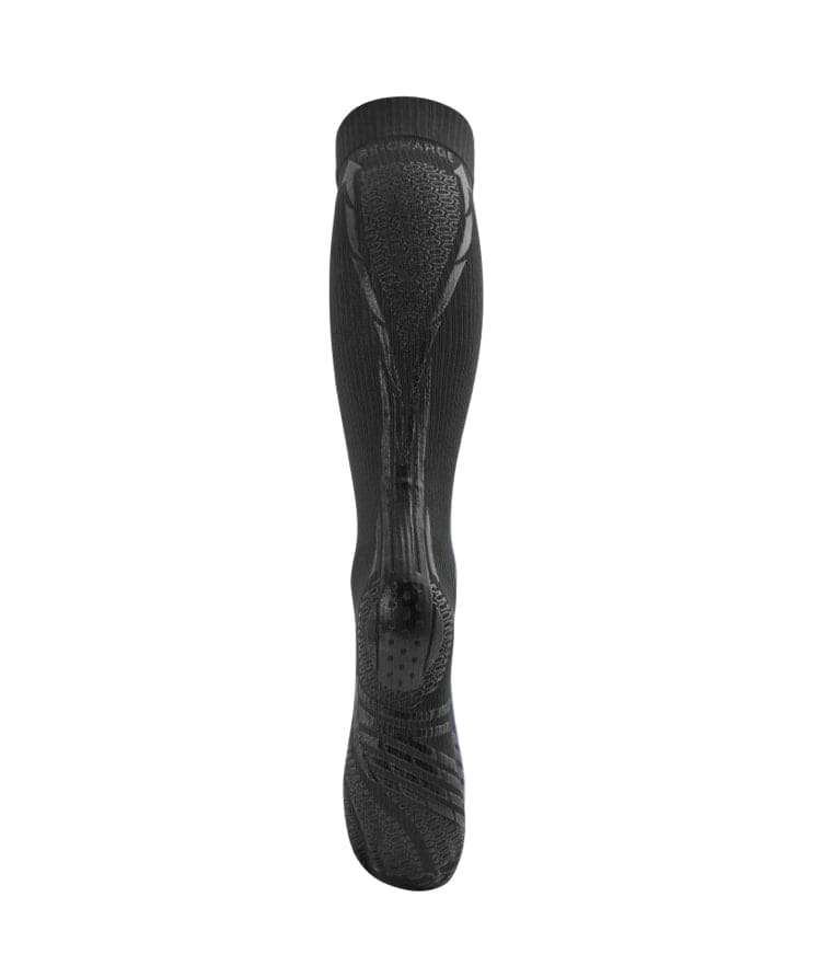 Single black Floky RE-CHARGE over-the-calf compression sock standing upright showing front view with anatomical contoured relief pattern and textured calf muscle support zones, RE-CHARGE branding visible, product shot on white background