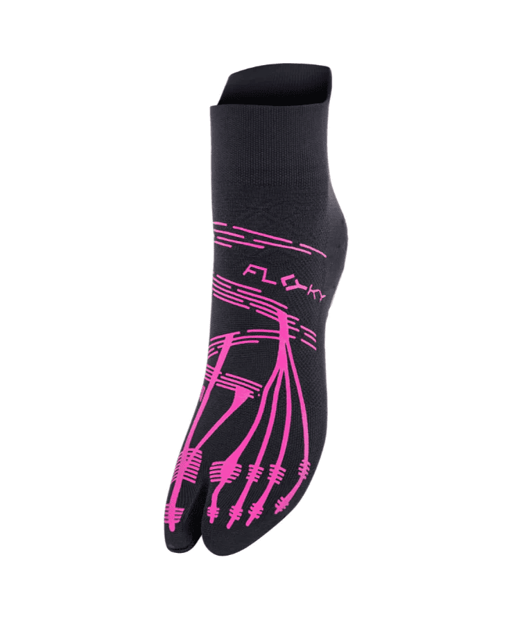 Angled side view of black Floky KINETICA Fuchsia pilates grip sock showing fuchsia FLOKY logo, anatomical toe-line grip pattern on sole and split-toe design, product shot on white background