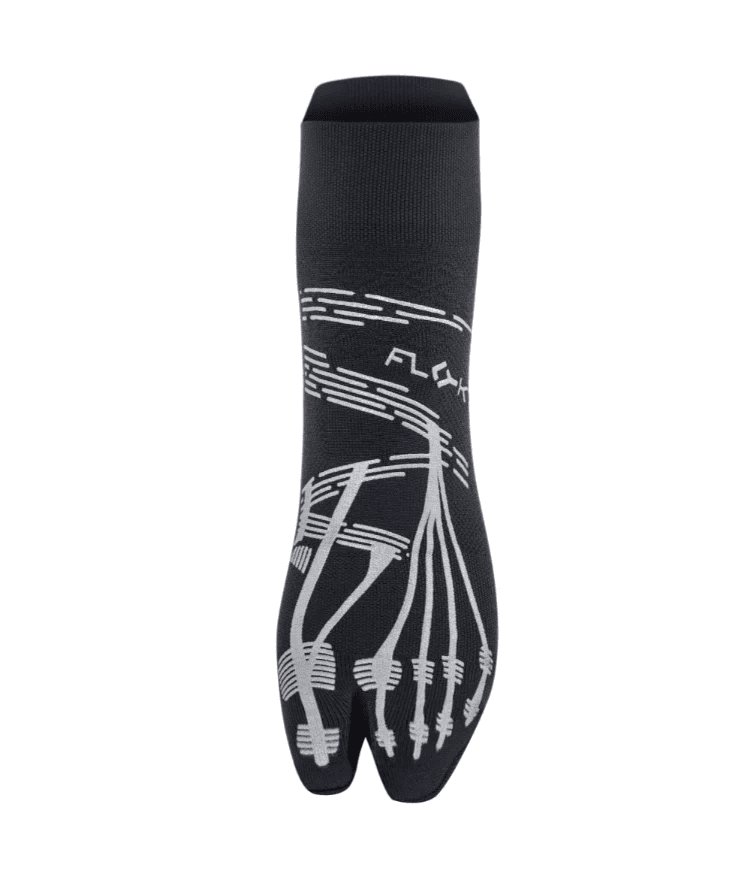 Front view of black Floky KINETICA Silver Metallic pilates grip sock showing silver anatomical toe-line grip pattern, FLOKY logo in silver at mid-foot and split-toe design, product shot on white background