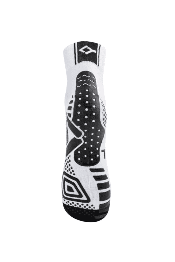 Floky Multisport short sock in white showing the grip sole with black Floky diamond logo and anti-slip dot pattern, straight sole view on white background