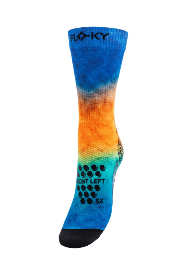 Floky S-Mash Fusion sock in royal blue to orange gradient with grip dot pattern, sole view showing left foot label, product shot on white background