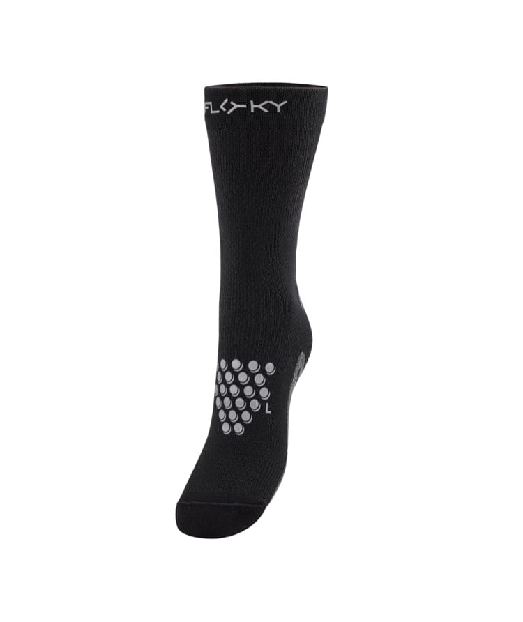Floky S-Mash sock in black with white hexagonal grip dot pattern and Floky label, side profile view, product shot on white background