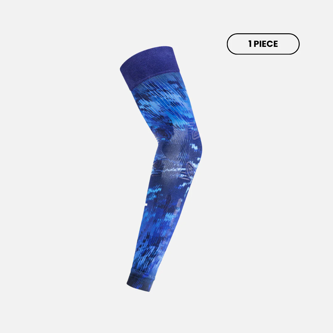 Side view of Floky No-Strain arm sleeve in Blue Supernova colourway showing deep navy to electric blue abstract camouflage pattern with anatomical zone mapping, single piece product shot on light grey background
